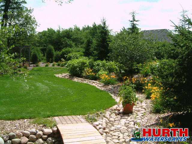 dry creek bed under a bridge